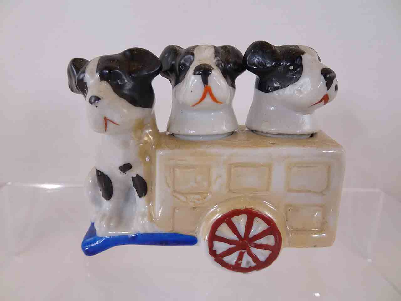 Dogs in cart salt and pepper shakers