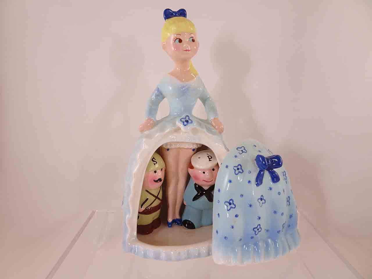Army and Navy guys hiding beneath lady's dress salt and pepper shakers - blue version