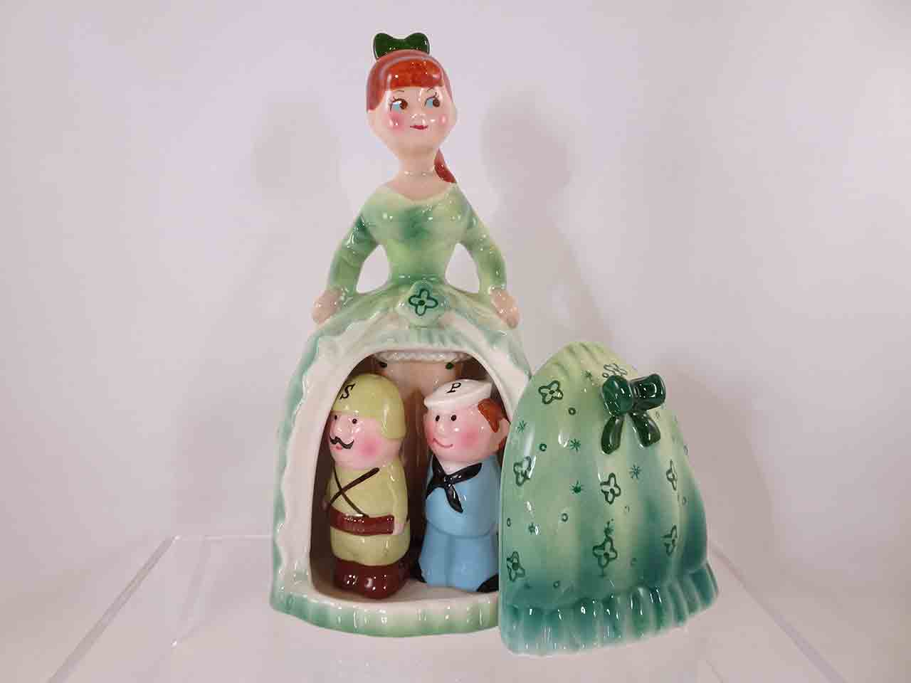 Army and Navy guys hiding beneath lady's dress salt and pepper shakers - green version