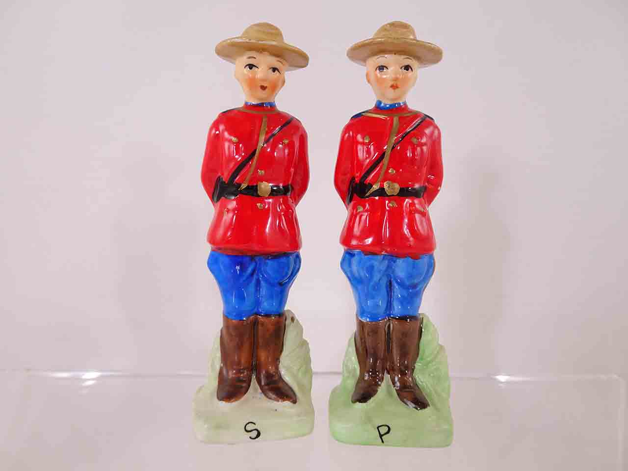 Metal pair of Royal Canadian Mounted Police salt and pepper shakers