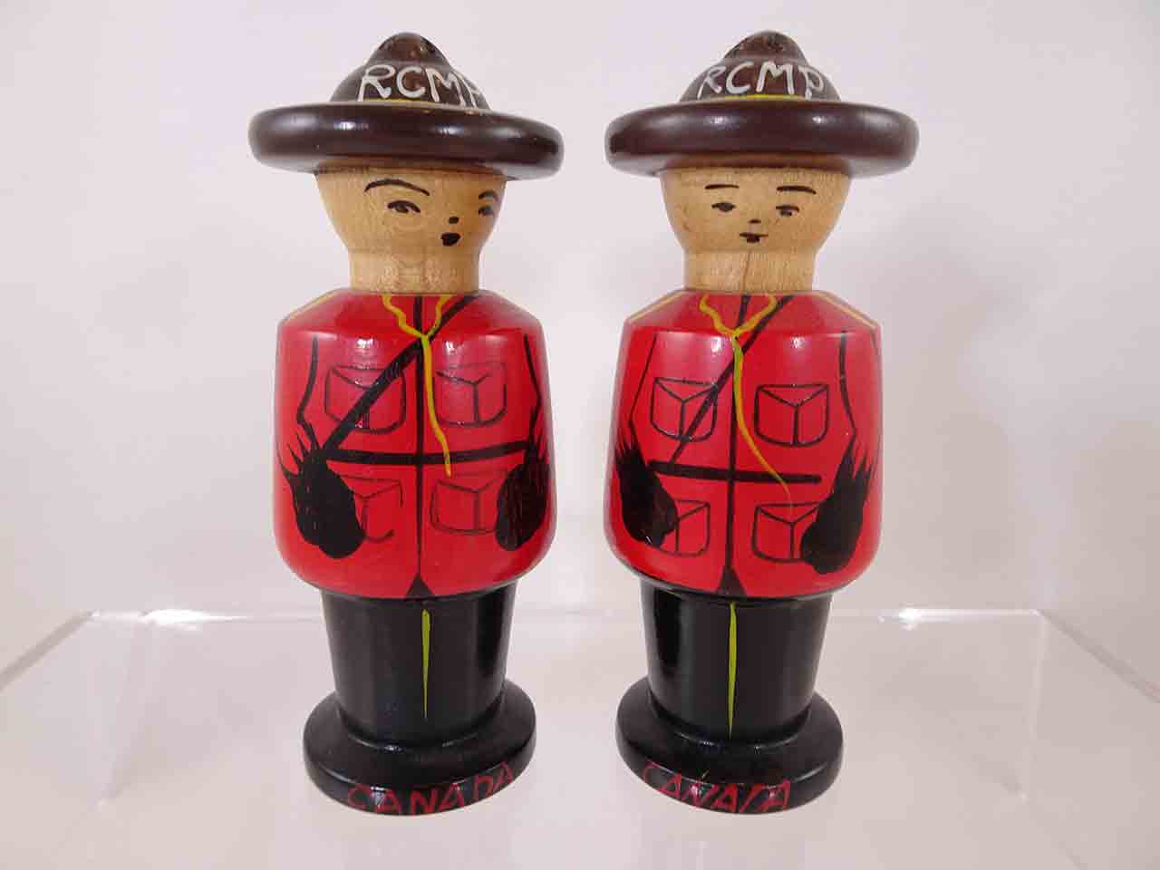 Wooden pair of Royal Canadian Mounted Police salt and pepper shakers