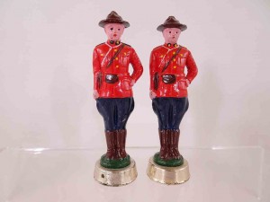 Metal pair of Royal Canadian Mounted Police salt and pepper shakers