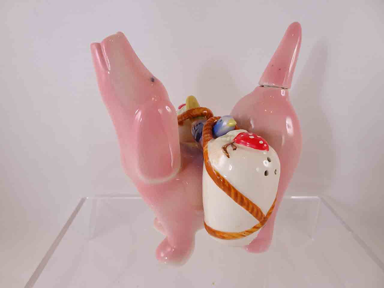 Pink dog carrier salt and pepper shakers