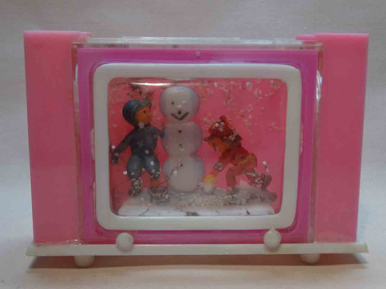 Kids in snow with snowman snow globe salt and pepper shaker